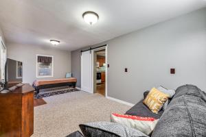 a living room with a couch and a table at Clear Lake Vacation Rental Walk to City Beach! in Clear Lake