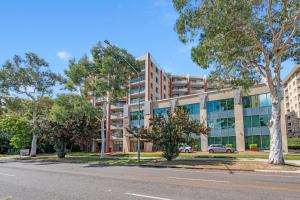 an apartment building on the side of a road at CityStyle Apartments in Canberra