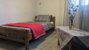 Postel nebo postele na pokoji v ubytování Avla Apartment