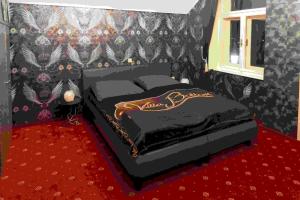 Un pat sau paturi într-o cameră la Villa Orasch mit Erotikflair
