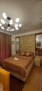 Postel nebo postele na pokoji v ubytování Studio-Type Condotel Mesatierra Garden Residences + 6 fotografií