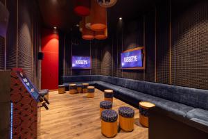 a room with a row of stools in a theater at Moon Palace The Grand Cancun All Inclusive in Cancún