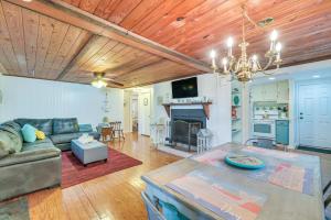 a living room with a couch and a table at Quiet Retreat with Boat Parking, 2 Mi to Marina in Inglis