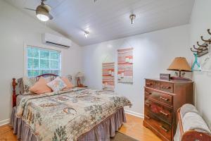 a bedroom with a bed and a dresser and a window at Quiet Retreat with Boat Parking, 2 Mi to Marina in Inglis