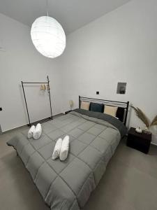 a bedroom with a large bed with white pillows at Ktimaoliva1 in Nafpaktos