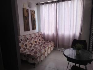 a living room with a couch and a table at San Joaquín B&B in Cali