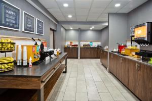 a fast food restaurant with wooden counters and a cafeteria at Hampton Inn & Suites Cape Coral / Fort Myers in Cape Coral