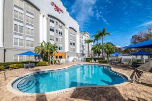 a pool in front of a hotel at Hampton Inn Lake Buena Vista / Orlando in Orlando