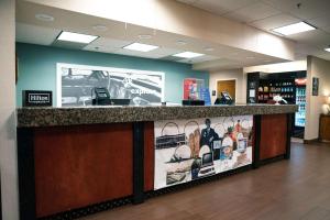 a store counter with a display of shoes at Hampton Inn Oklahoma City Northwest in Oklahoma City