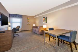 a living room with a table and a couch at Hampton Inn Princeton in Princeton