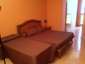 a bedroom with two beds in a room at B Palace in Ardea