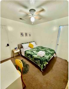 a bedroom with a bed and a ceiling fan at Cozy Private room with Shared bathroom Inside a house in Phoenix