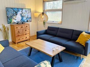 a living room with a couch and a coffee table at Holiday home Hasle CIX in Hasle