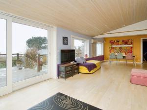 a living room with a large sliding glass door at 6 person holiday home in Frederiksværk-By Traum in Frederiksværk