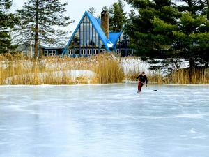 a man is skiing on a frozen lake at NewVida Preserve in Wilmington