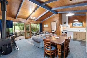 a kitchen and living room with a wooden ceiling at Clarendon Chalets in Mount Gambier