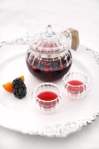 a glass dish with two cups of blackberry jam at Simatai No.19 Villa in Miyun