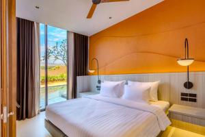 Postel nebo postele na pokoji v ubytování Hotel Adam Krabi