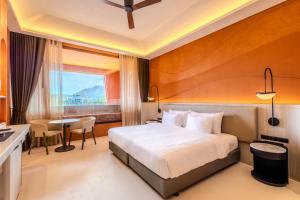 Postel nebo postele na pokoji v ubytování Hotel Adam Krabi