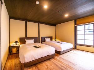 Katil atau katil-katil dalam bilik di NIPPONIA HOTEL Ozu Castle Town
