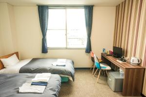 Postel nebo postele na pokoji v ubytování Hotel Ina