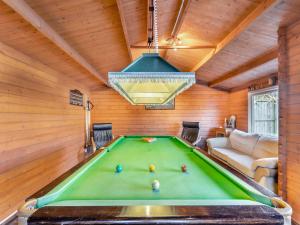 a room with a pool table in a house at The Lantern Tree in Kingsteignton