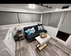 an overhead view of a living room with a blue couch at Dock life in Marathon
