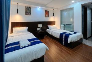 Cama ou camas em um quarto em YY City Garden Hotel Arayat Pampanga
