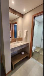 a bathroom with a sink and a mirror at Quinta Santa Bárbara eco resort in Pirenópolis