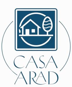 a logo for a real estate agency with a house at Casa Arad in Juan Díaz