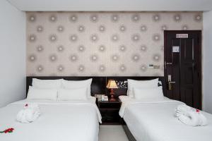 Postelja oz. postelje v sobi nastanitve Dylan Hotel Danang
