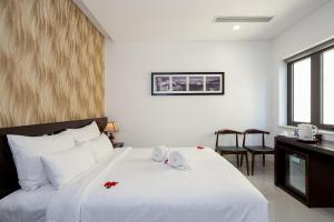 Postelja oz. postelje v sobi nastanitve Dylan Hotel Danang
