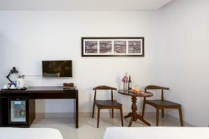 TV in/ali zabaviščno središče v nastanitvi Dylan Hotel Danang