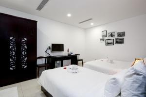 Postelja oz. postelje v sobi nastanitve Dylan Hotel Danang