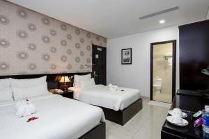 Postelja oz. postelje v sobi nastanitve Dylan Hotel Danang
