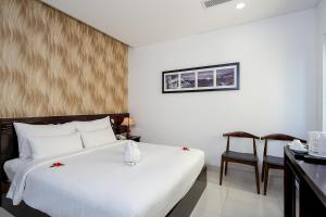 Postelja oz. postelje v sobi nastanitve Dylan Hotel Danang