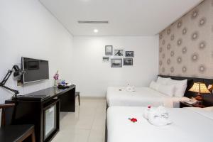 TV in/ali zabaviščno središče v nastanitvi Dylan Hotel Danang
