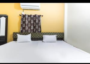 En eller flere senge i et værelse på Hotel anmol palace