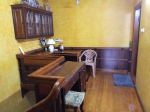 an office with a desk and a chair in a room at Court View Homestay in Cochin