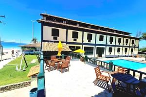 A piscina localizada em Flat Âncora Confortável Duplex a Beira mar ou nos arredores
