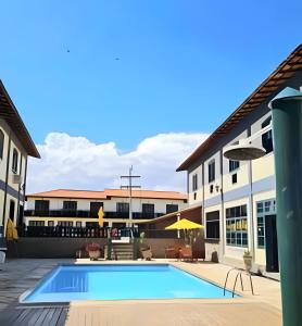A piscina localizada em Flat Âncora Confortável Duplex a Beira mar ou nos arredores