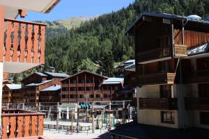 a view from the balcony of a hotel in a mountain village at Résidence Chaviere - Studio pour 3 Personnes 193091 in Modane