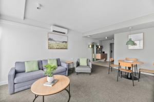 a living room with a couch and a table at Balgownie Estate Yarra Valley in Yarra Glen