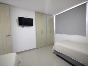 Krevet ili kreveti u jedinici u objektu Acogedor apartamento en exclusivo barrio de Barranquilla