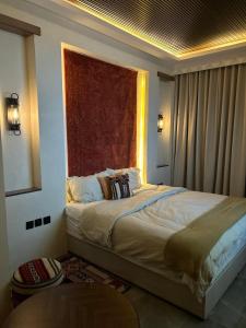 a bedroom with a large bed with a window at شقه بطراز نجدي فاخر 2 in Riyadh