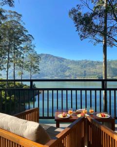 a balcony with a view of the water at The Farm Resorts in Hatton