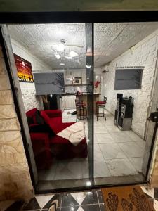 a view of a living room and kitchen from a mirror at Kika in Limpio