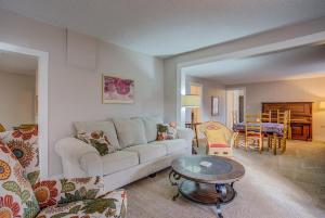 a living room with a couch and a table at 5BR Monument Charm Walk to Shops & Wedding Venue in Monument