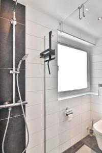 a bathroom with a shower and a sink at Loog 1 in Langeoog +10 photos
