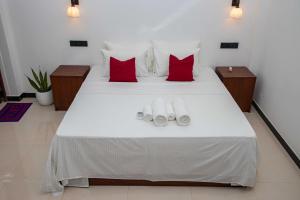 Postel nebo postele na pokoji v ubytování Randon Resort Mirissa